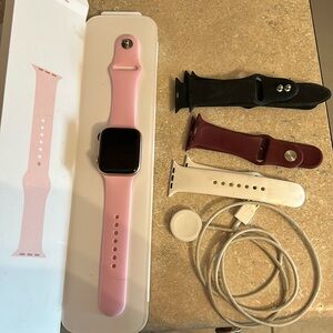 Apple Watch Series 4 with 44mm screen. With multiple bands and charger